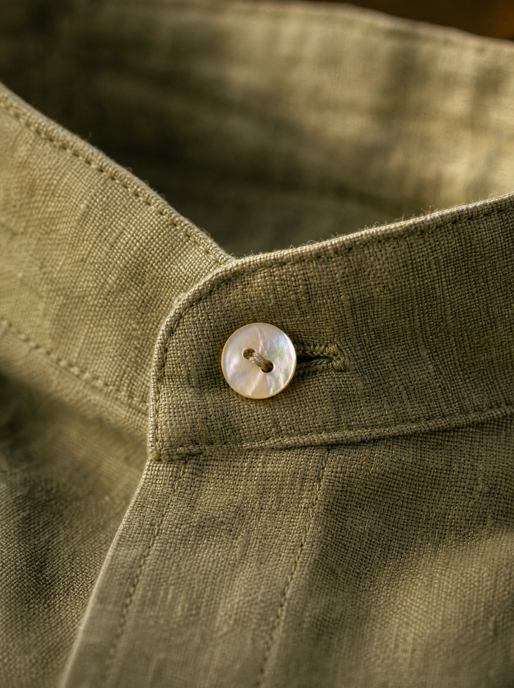 Mandarin collar and mother-of-pearl button detail — The Lipari Shirt