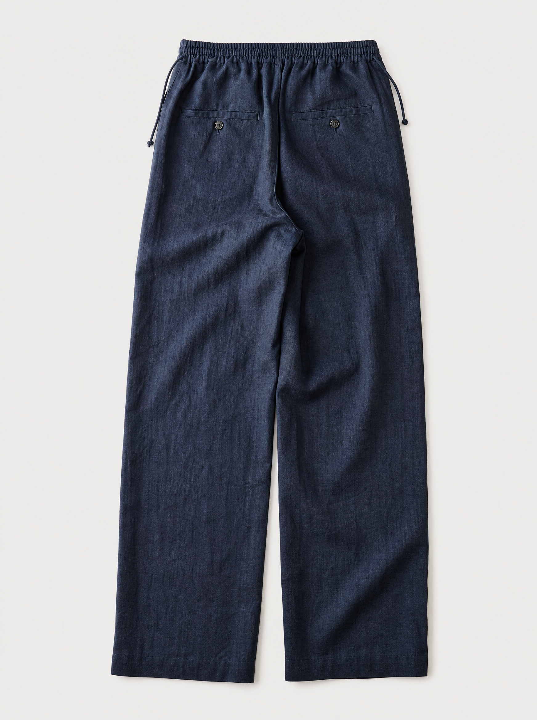 The Bastia Trouser — navy linen-cotton wide-leg drawstring trouser, back view