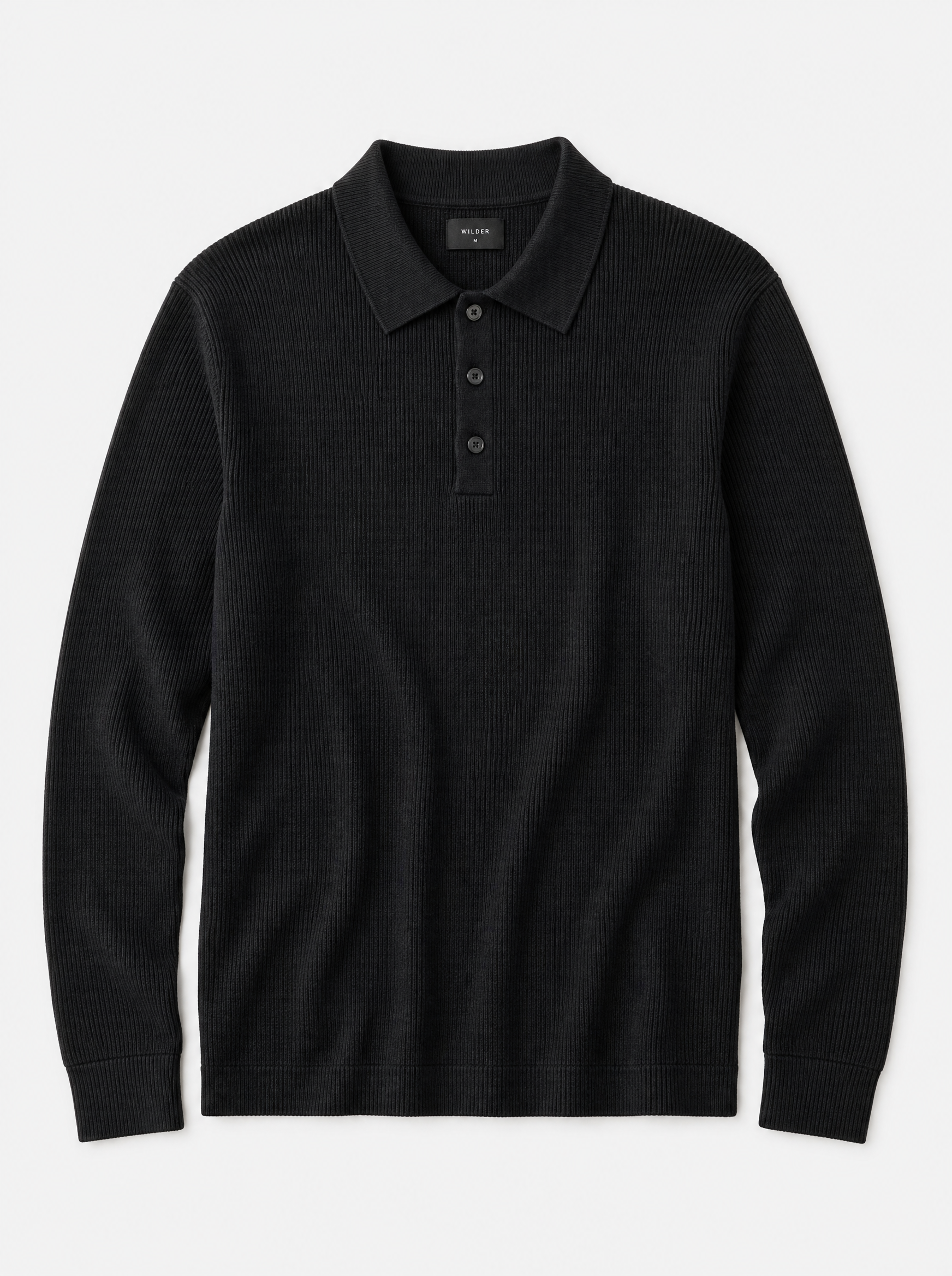 The Trani Polo — black ribbed knit cotton long-sleeve polo, front view