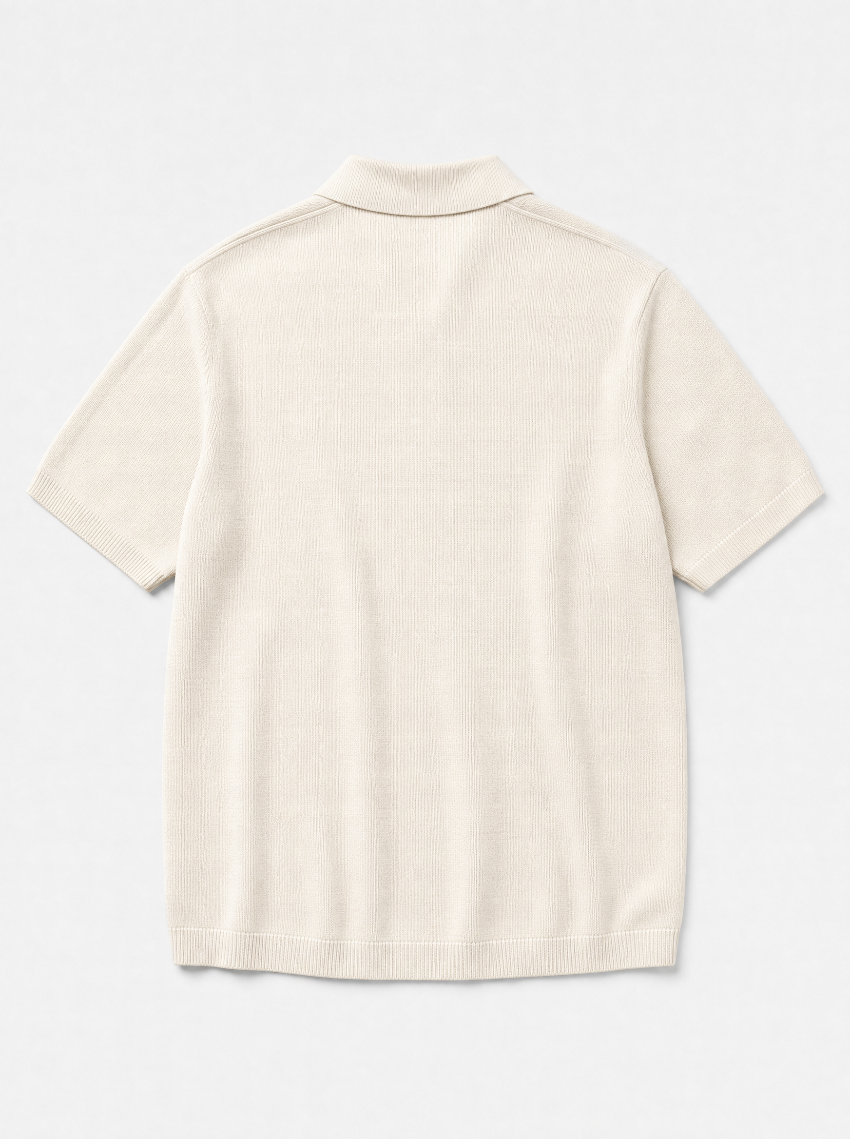 The Portofino Polo — ivory fine-gauge knit cotton short-sleeve henley polo, back view