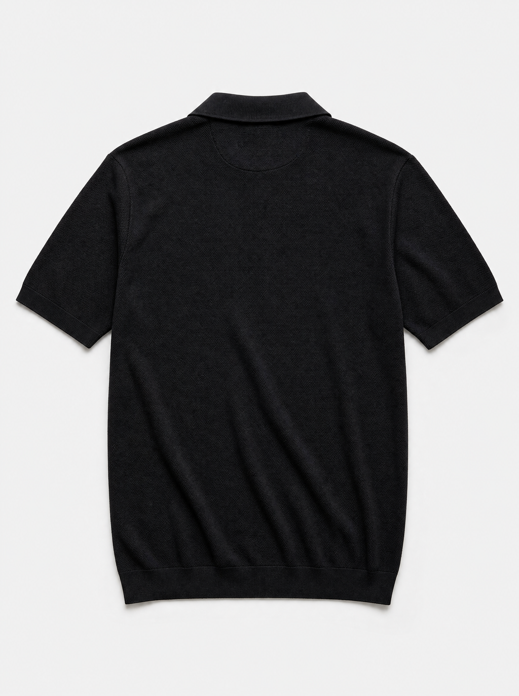 The Portofino Polo — black fine-gauge knit cotton short-sleeve henley polo, back view